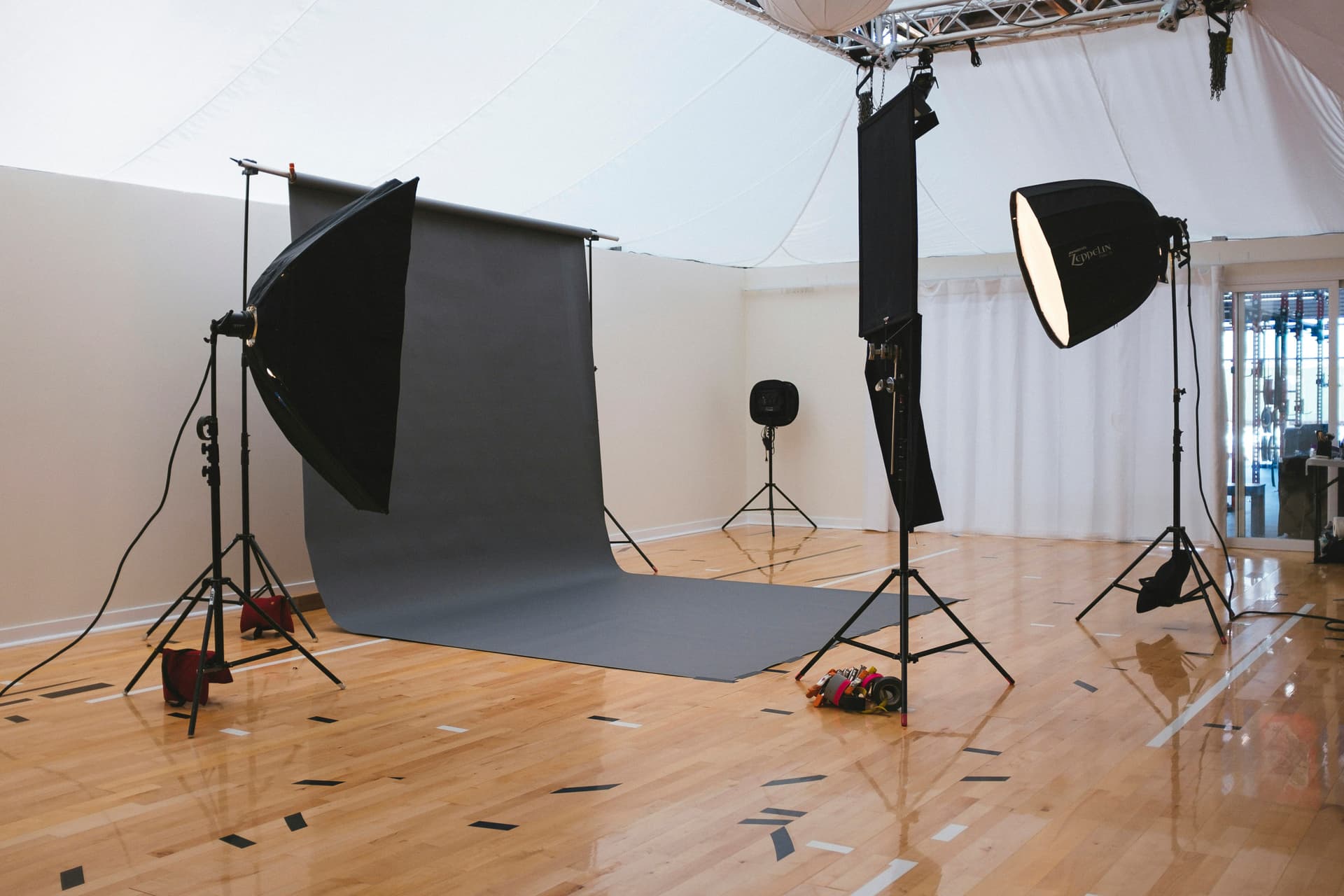 Professional photography studio with lighting equipment and backdrop